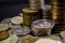 Coins stack on black background in concept wall and strong moneycoins on a black background