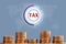 Coins stacked and tax virtual icon showing growht of business and trade. The concept of of paying taxes