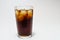 Cola coke in highball glass with ice cubes isolated on white background including clipping path.