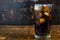 Cola drink, black soft drinks in a glass on the table