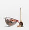 Colander with fresh friuts and berries and wooden cooking spoon at white background. Healthy food