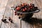 colander with fresh sweet healthy cherries on rustic