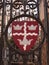 Colchester shield sign emblem on gates red and black town park