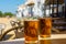 Cold amber color light spanish beer served in glass in outdoor cafe in town on sand, El Rocio in Andalusia, Spain
