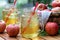 Cold apple juice with fresh apples outdoors on table