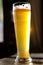 Cold Beer on Long Glass at Wooden Table