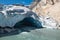 The cold blue ice of the impressive Nigardsbreen glacier melting into a wild river in Jostedalsbreen National Park