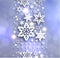 Cold blue sparkling Christmas background with snowflakes