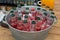 Cold bottles of drinks in bucket on a stall on open kitchen street food festival