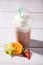 Cold caffe frappe on wooden background