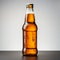 Cold delight Isolated hand clutches a refreshing beer bottle