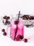 Cold Drink with Cherry in Jars on White Wooden Background Cold Detox Infused Water Summer Drink