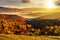 cold fog in carpathian rural valley at sunset