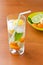 Cold fresh drink with lemon, lime, kumquat and mint.
