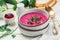 Cold fresh traditional vegetable summer soup made of beetroot beet