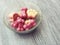 Cold frozen yogurt dog treats in a bowl on a hot summer day