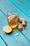 Cold medicines, tea, lemon and ginger on wooden blue background