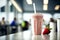 Cold milkshake of strawberries on a cafeteria.