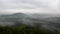 Cold misty night in a fall valley of Saxony Switzerland park. Hills increased from misty darkness.