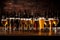 Cold mugs and glasses of beer on the old wooden table at the black background. Assortment of beer