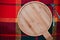 Cold season menu background, cooking or baking: round empty wooden cutting board on checkered cloth with knife and fork