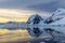 Cold still water of antarctic lagoon with glaciers and mountains