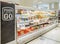 Cold storage fridge containing packaged pizzas, garlic breads, and pastas