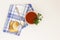 Cold summer tomato soup. Blue checkered napkin. White background. There is a place for text