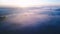 Cold sunrise sun microcosm like space. The earth is covered with thick fog. mystical delightful nature. Aerial video