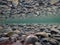 Cold underwater river bed with perfect reflection on surface