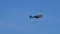 Cold war British propeller combat plane in flight in blue sky