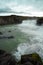 Cold water in Iceland. Godafoss waterfall in rocky mountains. Fr