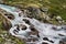 Cold water slashing through rocks