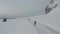 Cold white snowy winter landscapes with mountains and jagged peaks and a road bridge near Fredvang on the Lofoten Islands in Norwa