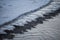 A cold winter morning, ice forms in the river