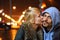 Coldly fall city. woman is kissing her man