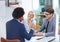 Collaborative connections in the workplace. three happy colleagues having a discussion in an office meeting.