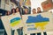 Collage. Active people standing with cardboard posters and saying to stop war in Ukraine.