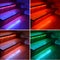 Collage of colored illuminated wooden stairs