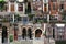 A collage of colorful old wooden front doors from Amsterdam and the Hague in Holland. Different beautiful entrance doors