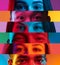 Collage of cropped multiethnic male and female eyes placed on narrow stripes in neon lights.