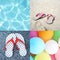 Collage of four pictures of sandal beach, colorful balloons and blue ripple water (Summer concept)