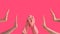 Collage of holding hands in the pink rubber gloves on the pink background with two other hands on each side without gloves.