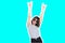 Collage in magazine style with colorful emotional fashion crazy girl in sunglasses scream with rock sign on blue background