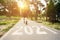 Collage of motivated male jogger running on path with 2021 inscription