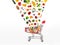 Collage of shopping cart with vegetables and fruits isolated on