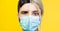 Collage of studio half face portraits of young woman and man, wearing safety medical flu mask against coronavirus.