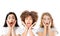 Collage of surprised shocked excited asian, afro american and caucasian women faces isolated on white background. Beautiful young