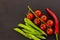 Collage vegetable set pod pea green branch tomato chili pepper asia recipe black background