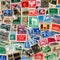 A collage of vintage postage stamps from around the world, showcasing diverse cultures and histories1, Generative AI